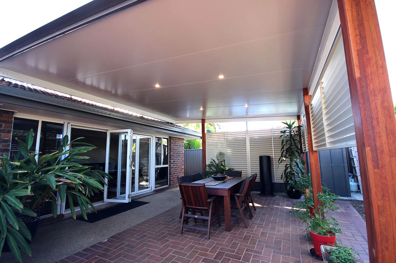 Insulated patio with downlights over an outdoor dining area